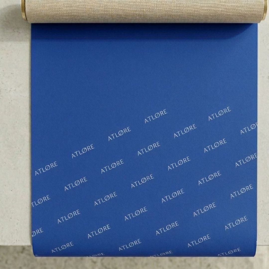 Vibrant blue custom wrapping paper with white logo