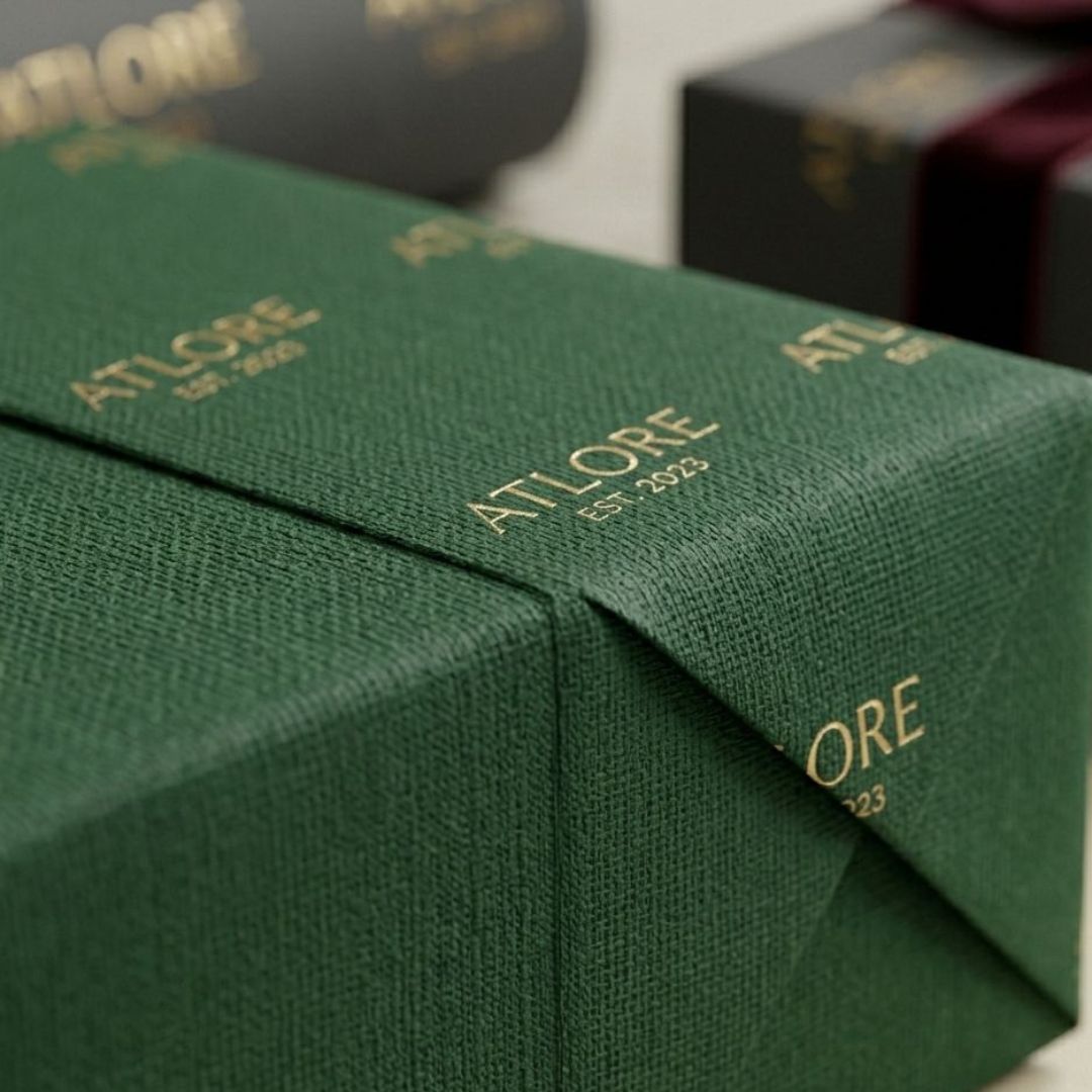 luxury jewelry gift box wrapped in forest green wrapping paper