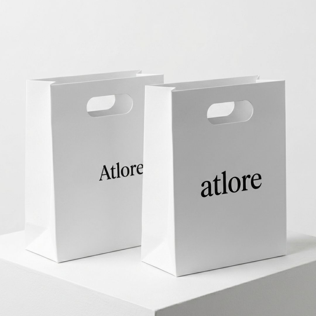  Premium thick white art cardstock packaging bags with a smooth matte coating and modern die-cut handles.