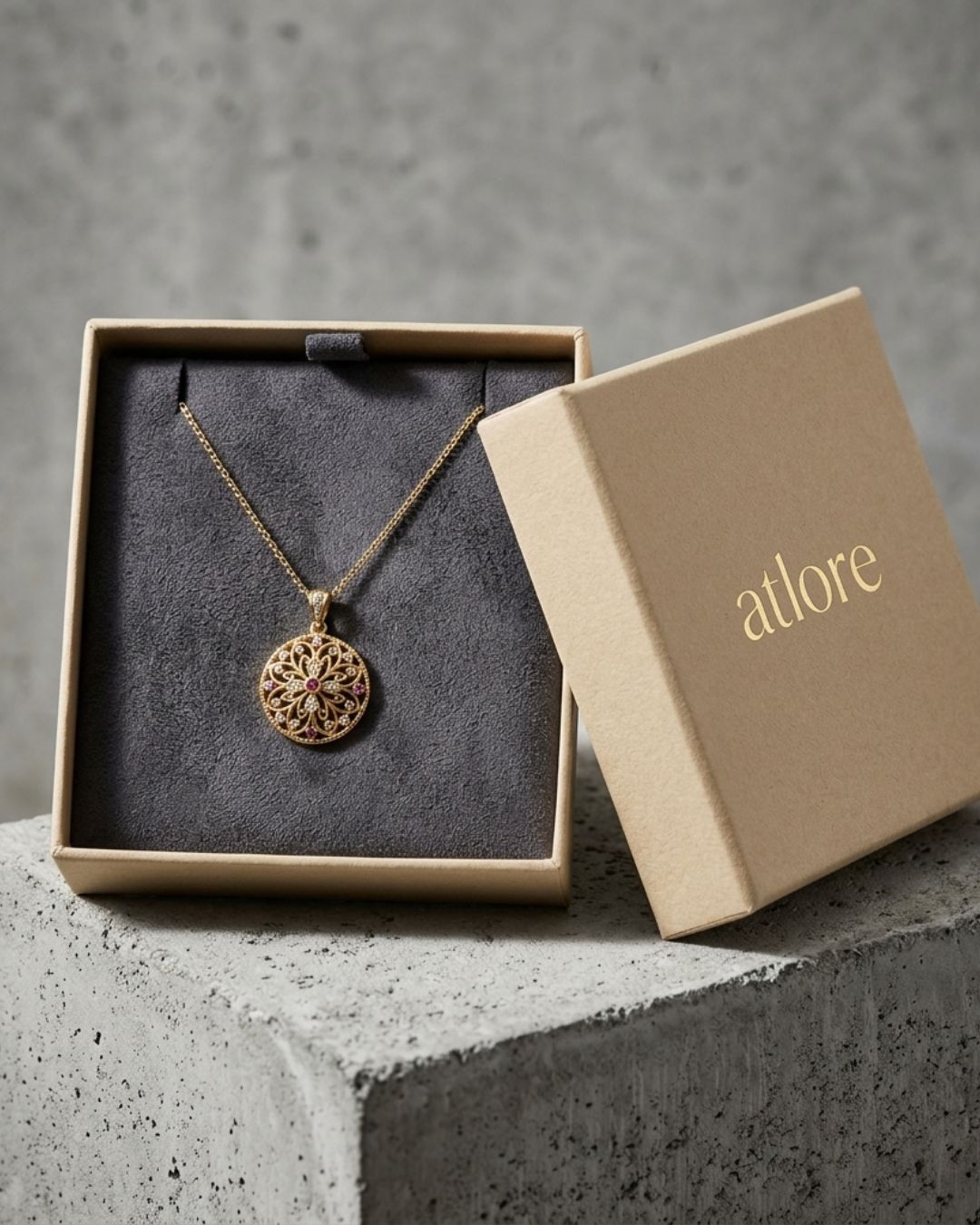 Custom premium warm beige paper 2-piece pendant packaging box featuring a charcoal grey suede covered inner pad by Atlore.
