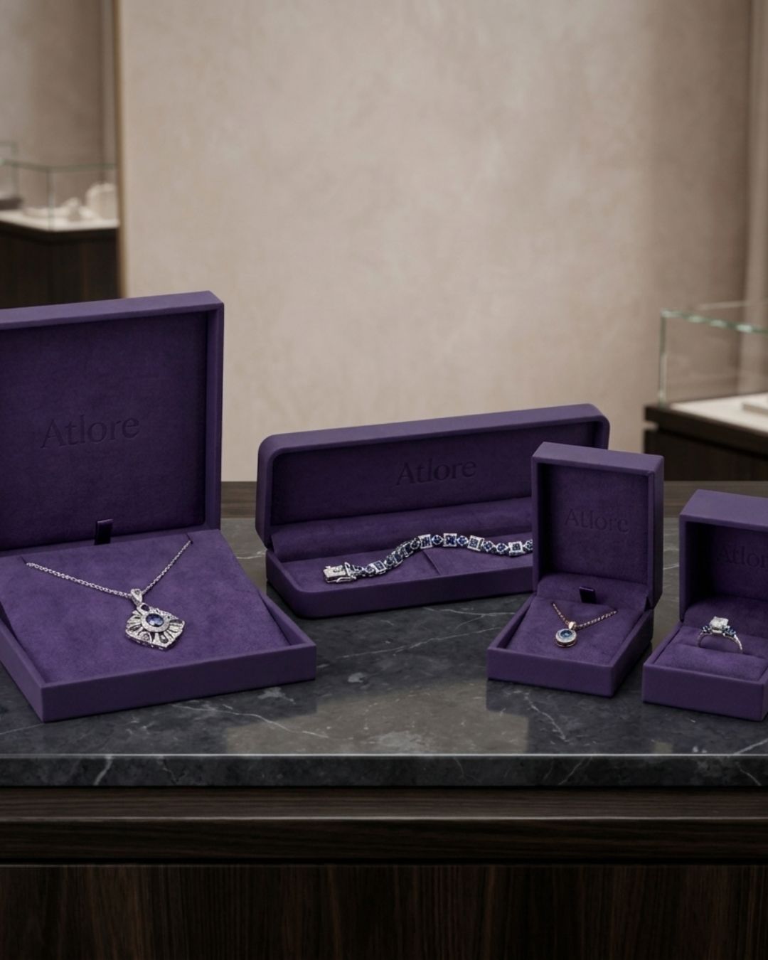 Wholesale 4-piece matte violet paper-plastic hybrid jewelry box suite featuring plush deep violet suede interior linings by Atlore.